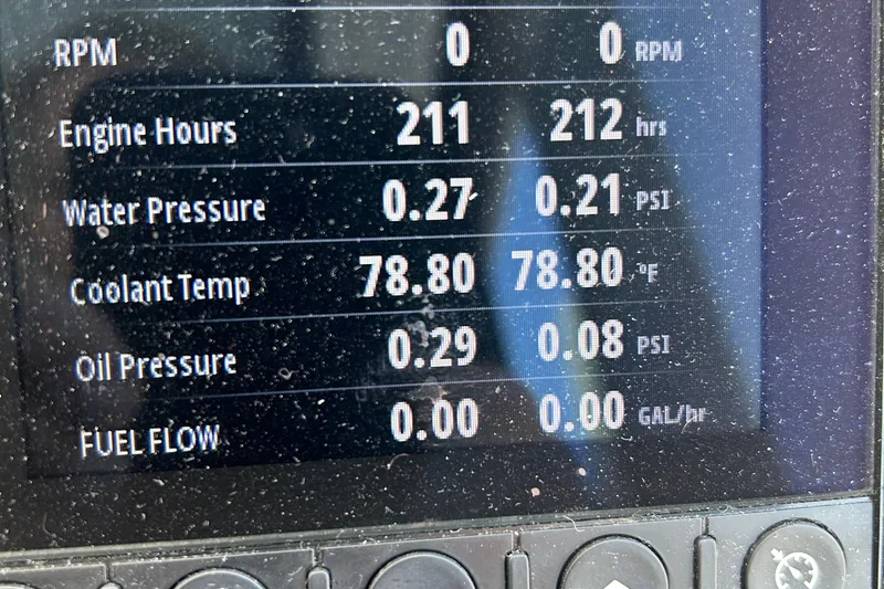 Slide: The Image of Display panel of a 2022 Beneteau Antares 11 showing engine metrics and performance data. - 20