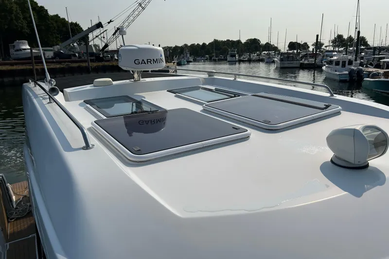 Slide: The Image of 2022 Beneteau Antares 11 yacht with Garmin equipment, docked in a marina. - 7
