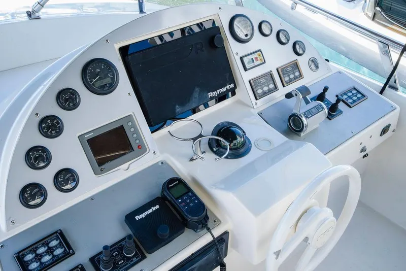 Slide: The Image of Control panel of a 2006 Aicon Flybridge yacht with navigation instruments. - 21