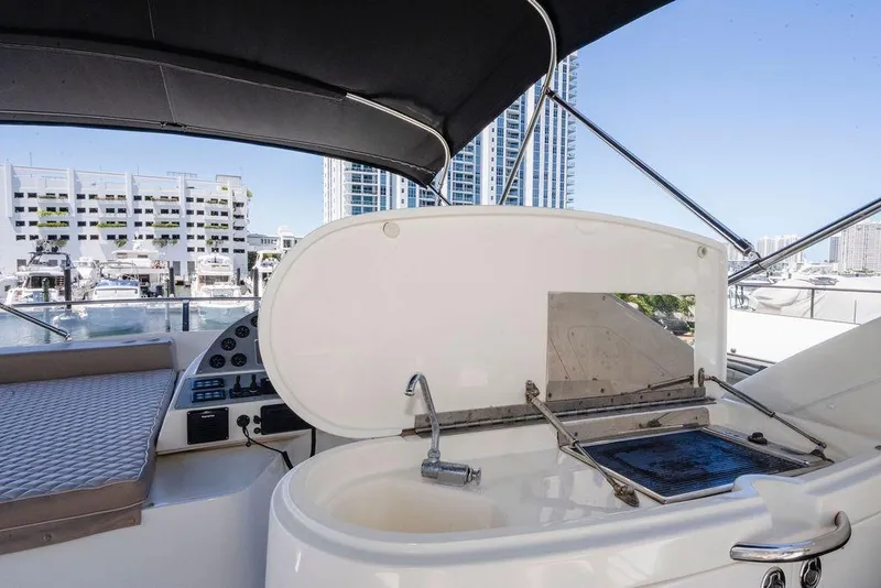 Slide: The Image of Flybridge of 2006 Aicon yacht with grill and sink, overlooking marina and cityscape. - 23