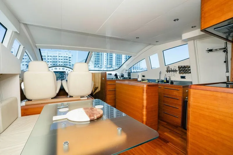 Slide: The Image of Luxurious interior of 2006 Aicon Flybridge yacht with modern kitchen and seating area. - 42