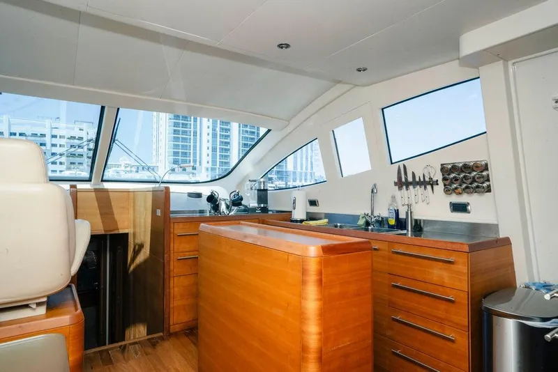 Slide: The Image of Interior of 2006 Aicon Flybridge yacht with modern kitchen and large windows. - 49
