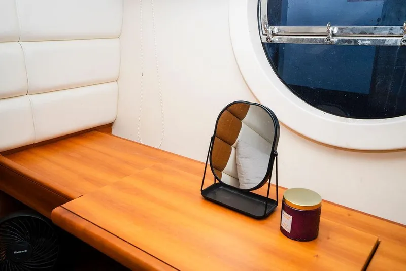 Slide: The Image of Interior of 2006 Aicon Flybridge yacht with mirror and round window. - 66