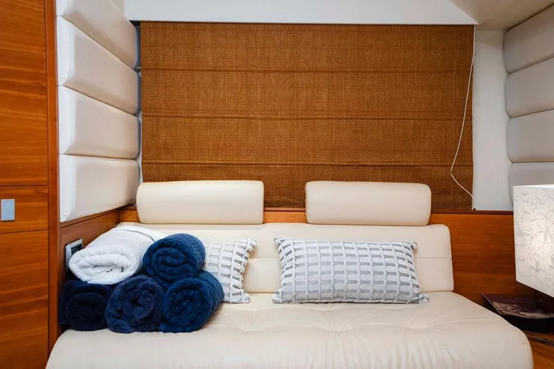 Slide: The Image of Luxurious interior of 2006 Aicon Flybridge yacht with plush seating and rolled towels. - 77