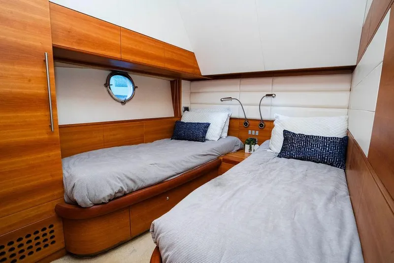 Slide: The Image of Luxurious twin cabin interior of 2006 Aicon Flybridge yacht with wooden finishes. - 88