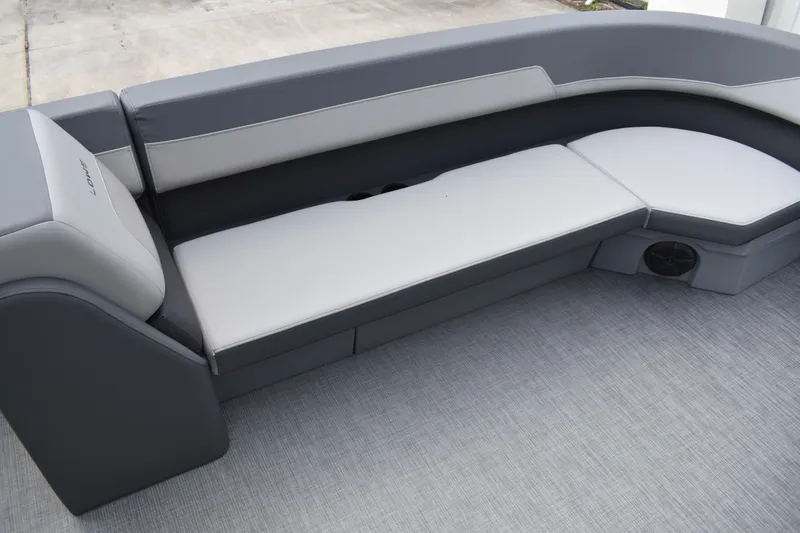 Slide: The Image of 2026 Lowe LF 232 boat seat with gray upholstery and integrated cup holders. - 14