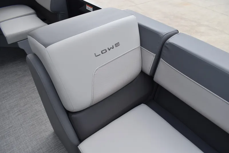 Slide: The Image of 2026 Lowe LF 232 boat interior storage compartment with cushioned seating. - 16