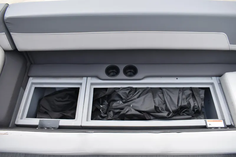 Slide: The Image of 2026 Lowe LF 232 boat storage compartment with cushioned seating, gray interior. - 19