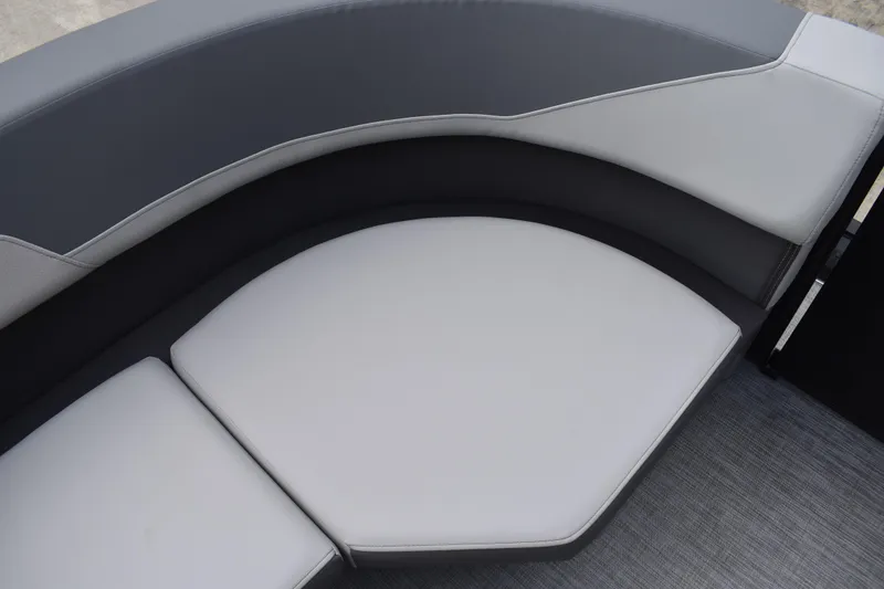 Slide: The Image of 2026 Lowe LF 232 boat interior with gray seating and console. - 20