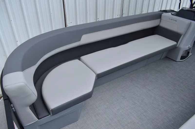 Slide: The Image of Luxurious seating on 2026 Lowe LF 232 boat, featuring sleek gray upholstery. - 22