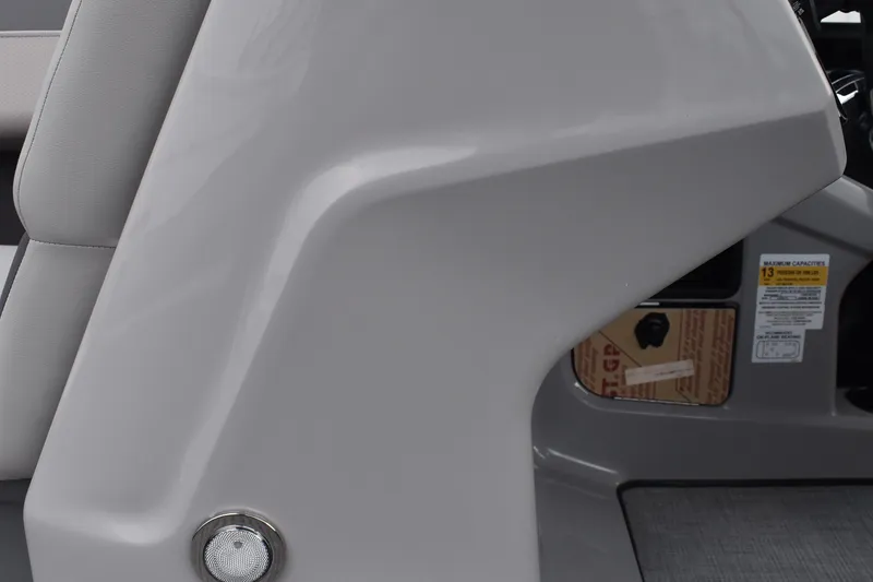 Slide: The Image of Steering wheel of 2026 Lowe LF 232 boat, featuring modern dashboard controls. - 32