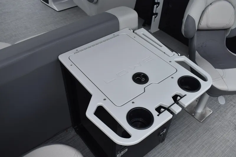 Slide: The Image of 2026 Lowe LF 232 pontoon boat with Mercury engine, parked on a trailer. - 48