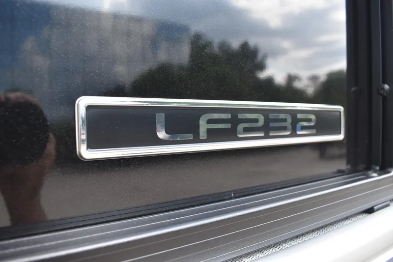 Slide: The Image of 2026 Lowe LF 232 boat interior with spacious gray seating and modern design. - 7