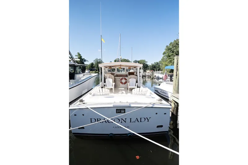 Slide: The Image of 1972 Jarvis Newman Downeast boat "Dragon Lady" docked in a marina, rear view. - 10