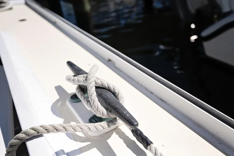 Slide: The Image of Rope tied to cleat on 1972 Jarvis Newman Downeast boat deck. - 35