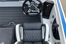 Slide: The Image of 2026 Phoenix 721zxl boat cockpit with steering wheel and cushioned seat. - 6