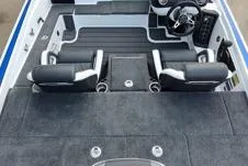Slide: The Image of Interior of 2026 Phoenix 721zxl boat with black and white seating and modern dashboard. - 8