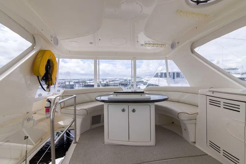 Slide: The Image of Luxurious interior of 2009 Silverton Oviation 52 yacht with panoramic windows and seating area. - 17