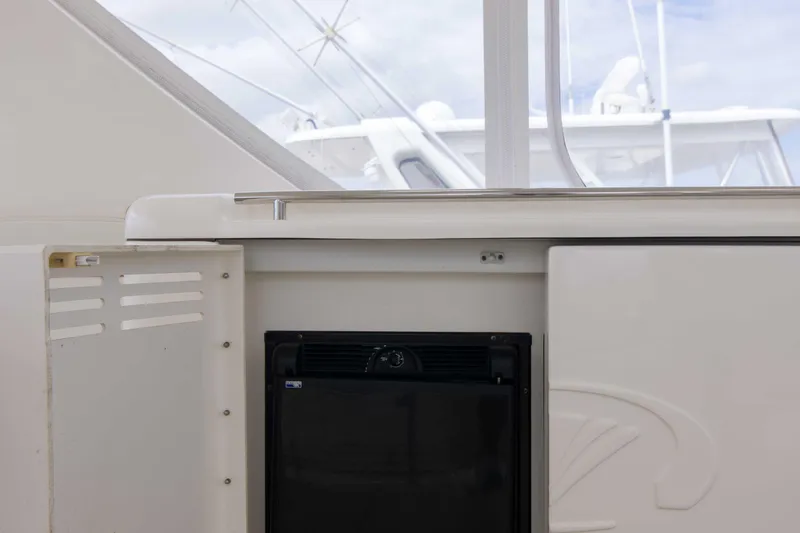 Slide: The Image of 2009 Silverton Oviation 52 yacht interior with built-in mini fridge. - 19
