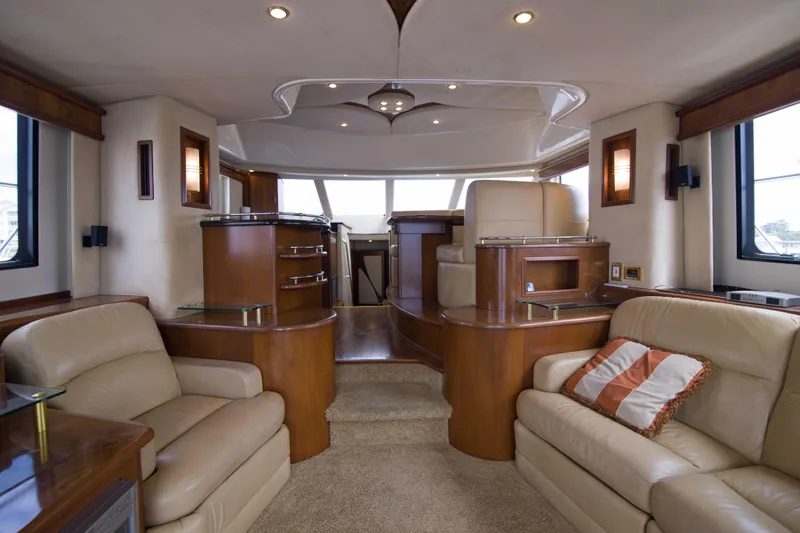 Slide: The Image of Luxurious interior of 2009 Silverton Oviation 52 yacht with plush seating and elegant wood finishes. - 31