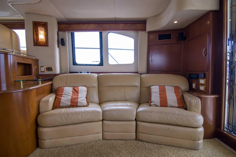 Slide: The Image of Luxurious interior of 2009 Silverton Oviation 52 yacht with beige leather sofa. - 33