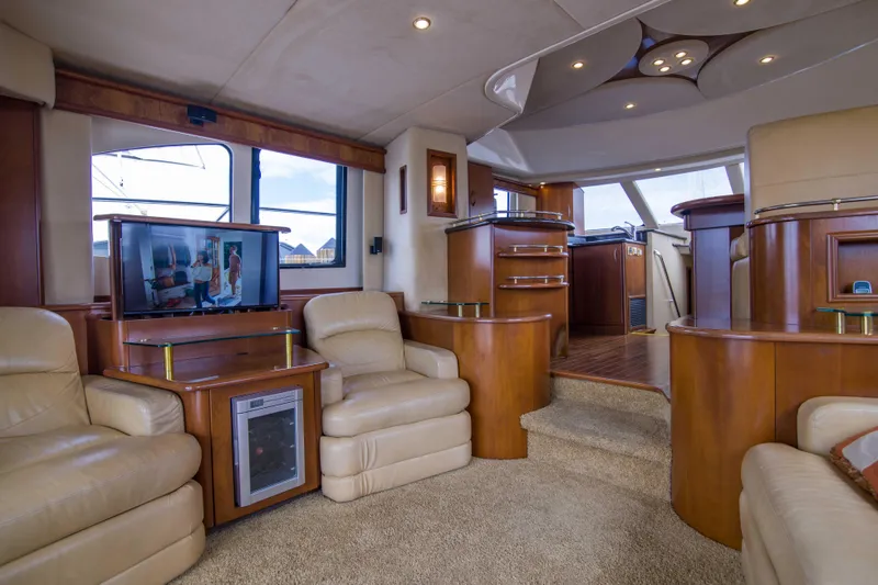 Slide: The Image of Luxurious 2009 Silverton Oviation 52 yacht interior with leather seating and modern entertainment system. - 36