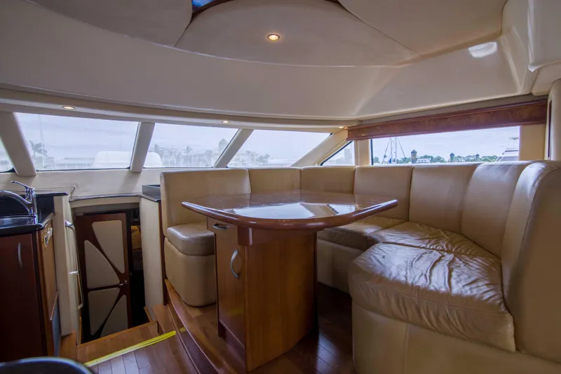 Slide: The Image of Luxurious interior of 2009 Silverton Oviation 52 yacht with plush seating and wooden table. - 37