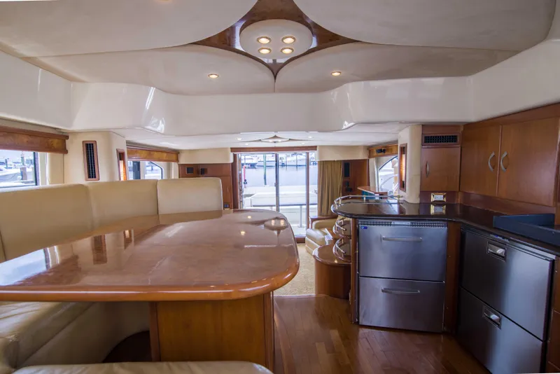 Slide: The Image of Luxurious interior of 2009 Silverton Oviation 52 yacht with modern kitchen and seating area. - 43