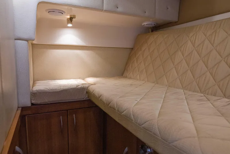 Slide: The Image of Interior cabin of 2009 Silverton Oviation 52 yacht with beige quilted seating. - 46