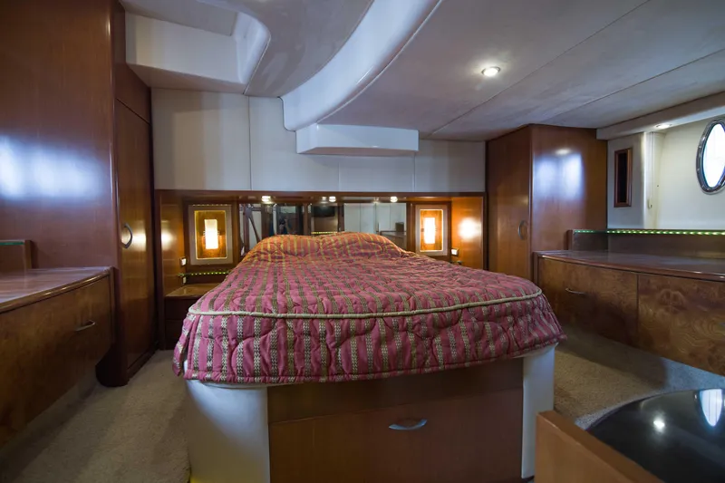 Slide: The Image of Luxurious bedroom interior of 2009 Silverton Oviation 52 yacht with elegant wood finishes. - 50