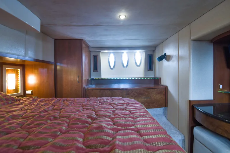 Slide: The Image of Luxurious cabin interior of 2009 Silverton Oviation 52 yacht with elegant wood finishes. - 52