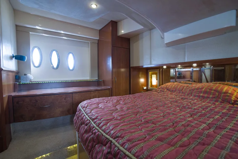 Slide: The Image of Luxurious bedroom interior of 2009 Silverton Oviation 52 yacht with elegant wood finishes. - 53