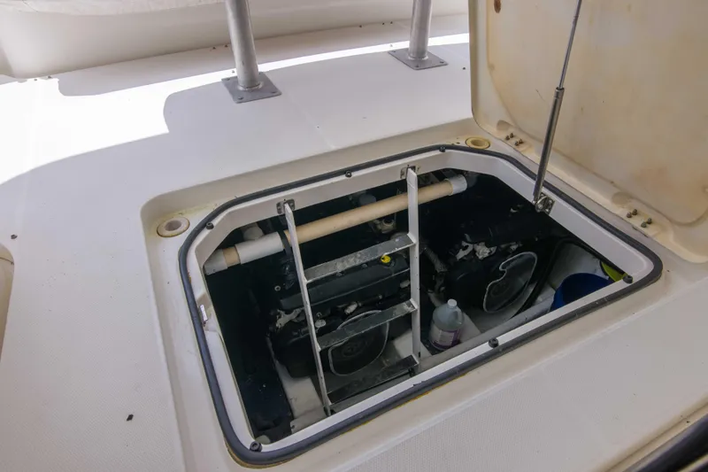 Slide: The Image of Engine compartment of a 2009 Silverton Oviation 52 yacht, showing mechanical components. - 54