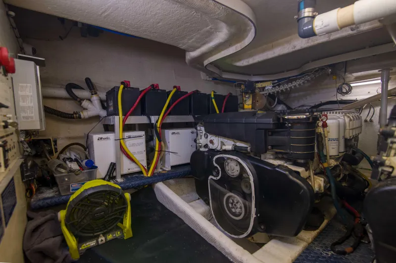 Slide: The Image of Engine room of 2009 Silverton Oviation 52 yacht with batteries and machinery. - 57