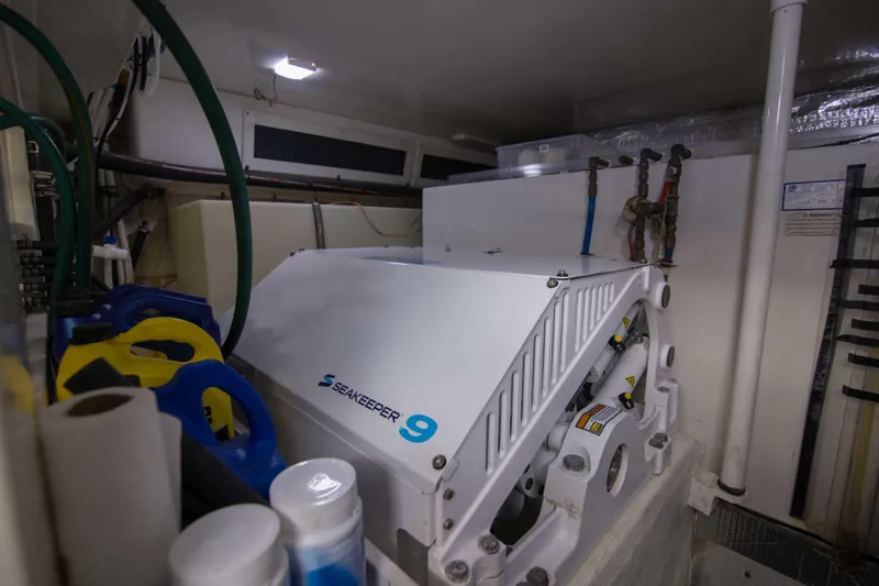 Slide: The Image of Engine room of 2009 Silverton Oviation 52 with Seakeeper 9 stabilizer system. - 59