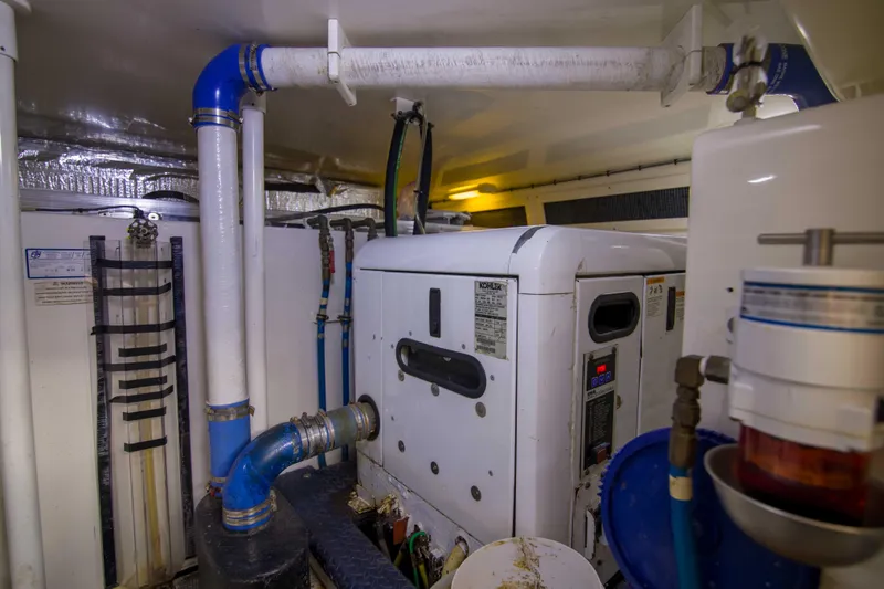Slide: The Image of Engine room of 2009 Silverton Oviation 52 yacht with visible machinery and piping. - 60