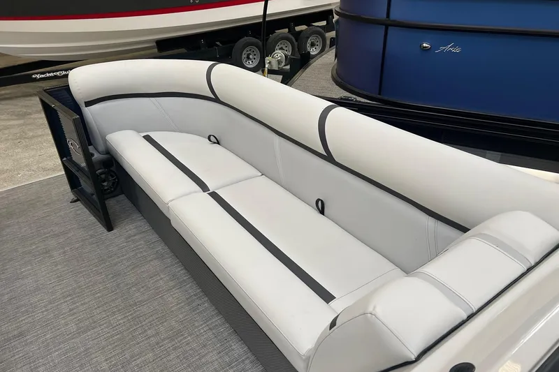 Slide: The Image of 2023 Crest LX 240 SLC boat interior with sleek white seating and modern design. - 3
