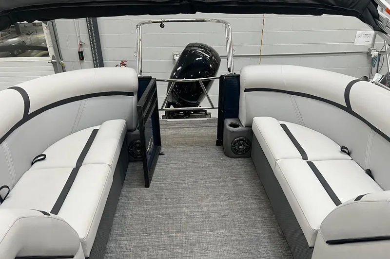 Slide: The Image of 2023 Crest LX 240 SLC pontoon boat interior with white seating and modern design. - 4