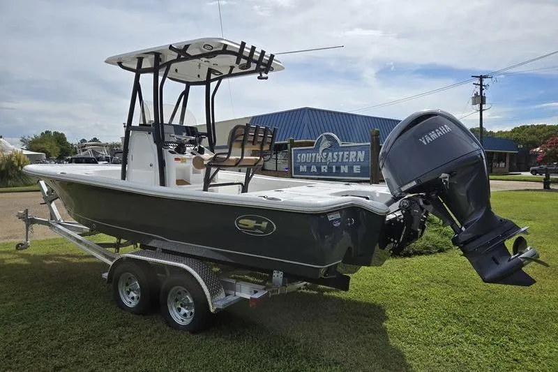 Slide: The Image of 2026 Sea Hunt BX 22 BR boat on trailer, displayed at Southeastern Marine dealership. - 1