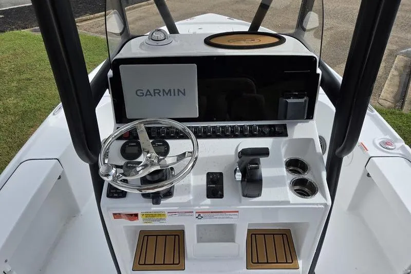 Slide: The Image of 2026 Sea Hunt BX 22 BR boat console with Garmin navigation system and steering wheel. - 15