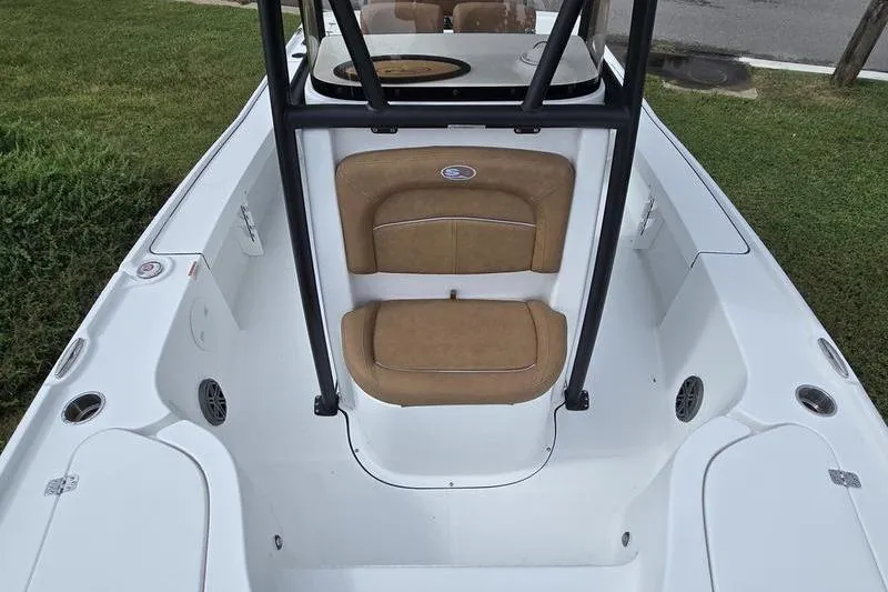 Slide: The Image of 2026 Sea Hunt BX 22 BR boat interior with tan seating and white deck. - 16