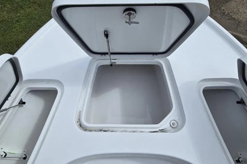 Slide: The Image of 2026 Sea Hunt BX 22 BR boat storage compartments open, showcasing spacious interior. - 17