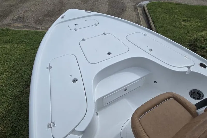 Slide: The Image of 2026 Sea Hunt BX 22 BR boat deck with storage compartments and seating. - 18