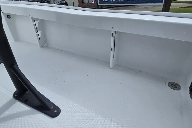 Slide: The Image of 2026 Sea Hunt BX 22 BR boat interior, showcasing clean white deck and storage area. - 20