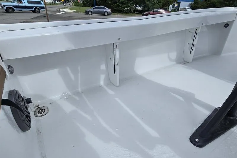 Slide: The Image of Interior view of a 2026 Sea Hunt BX 22 BR boat, showcasing clean white deck. - 4