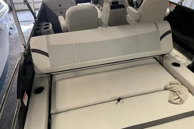 Slide: The Image of 2023 Crest LX 240SLSC boat interior with plush seating and cup holders. - 7