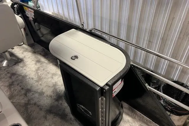 Slide: The Image of 2023 Crest LX 240SLSC boat interior with sleek table and modern design. - 8