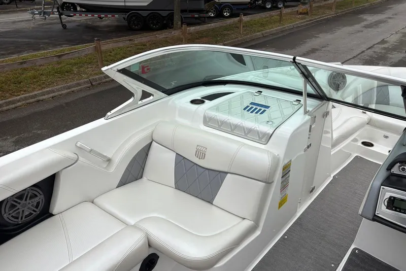 Slide: The Image of 2014 MasterCraft X10 boat interior with white seating and modern dashboard. - 11