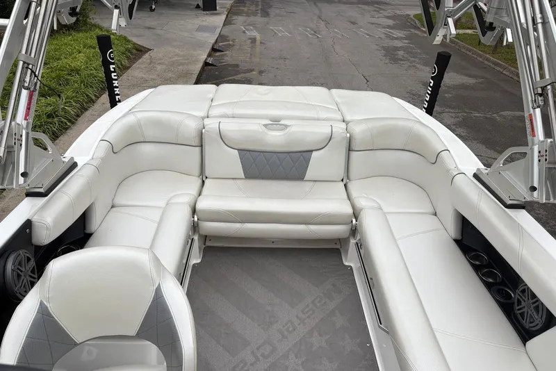 Slide: The Image of 2014 MasterCraft X10 boat interior with white leather seating and modern design. - 15