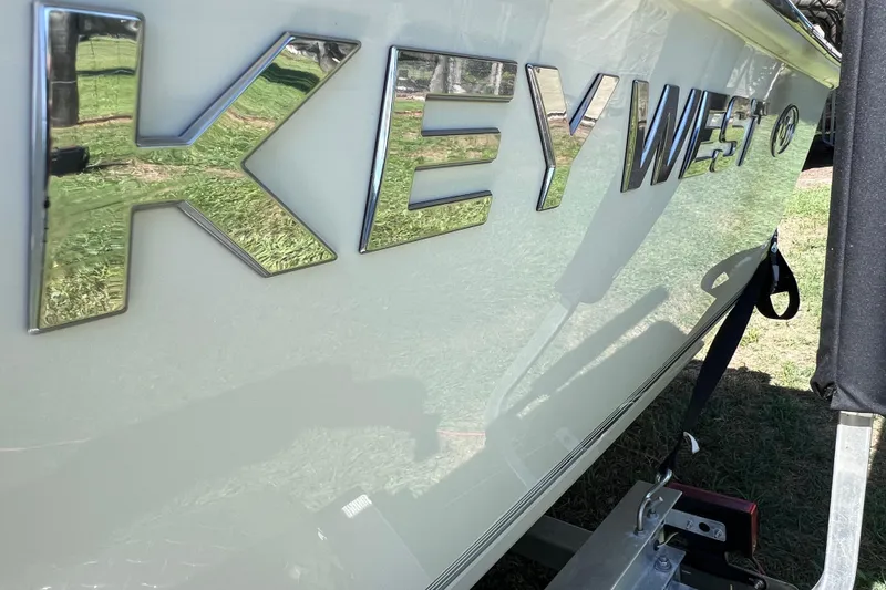 Slide: The Image of 2020 Key West 230 Bay Reef boat with chrome lettering on the side. - 17